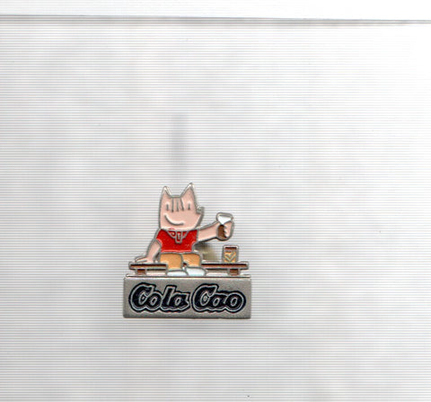 Pins: Cobi brindando con propaganda Cola Cao