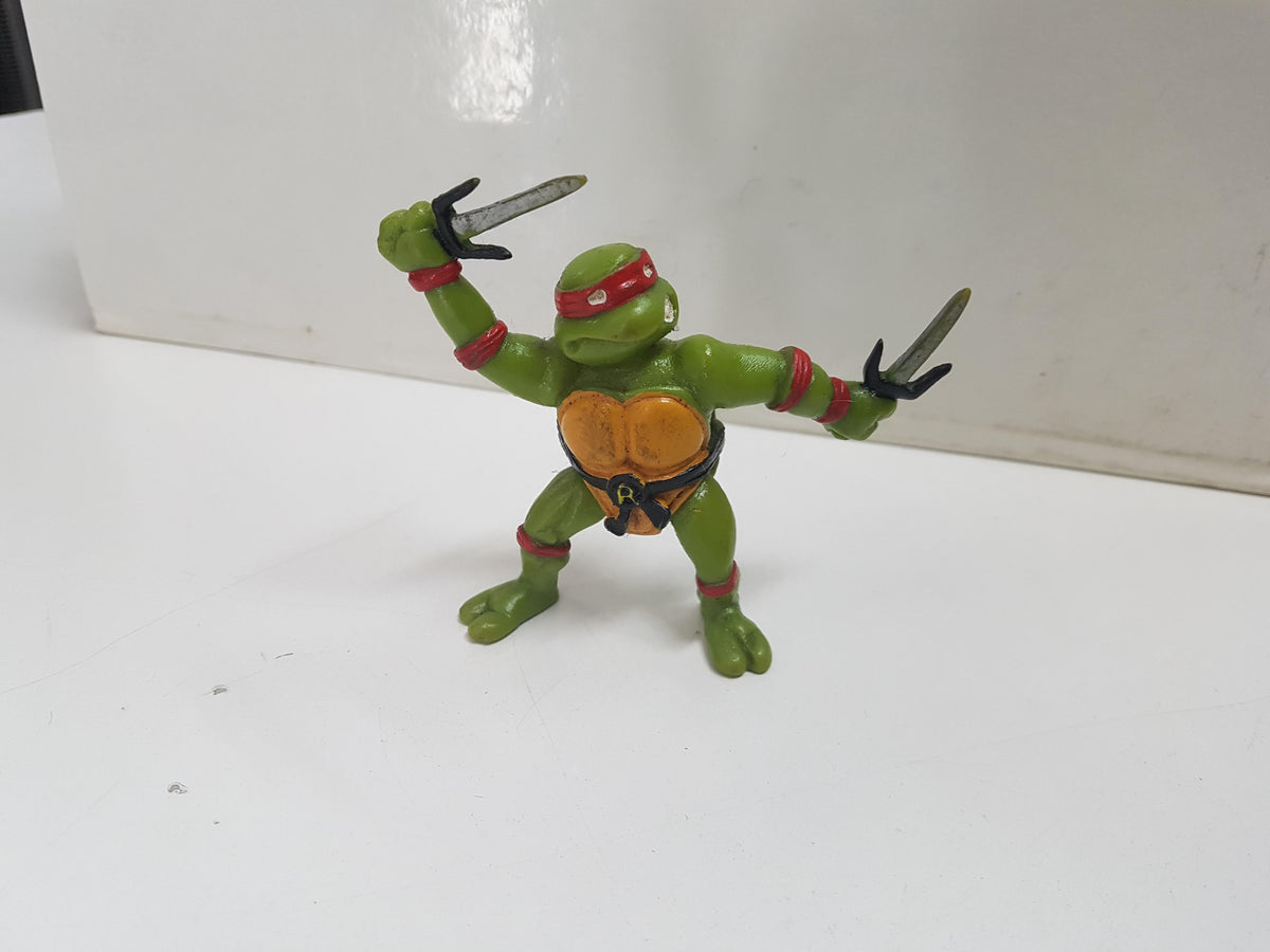 Figura serie Las Tortugas Ninja: Raphael, esgrimiendo sus sais