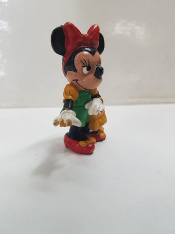 Figura de la serie Mickey Mouse: Minnie Mouse con vestido verde y bolso