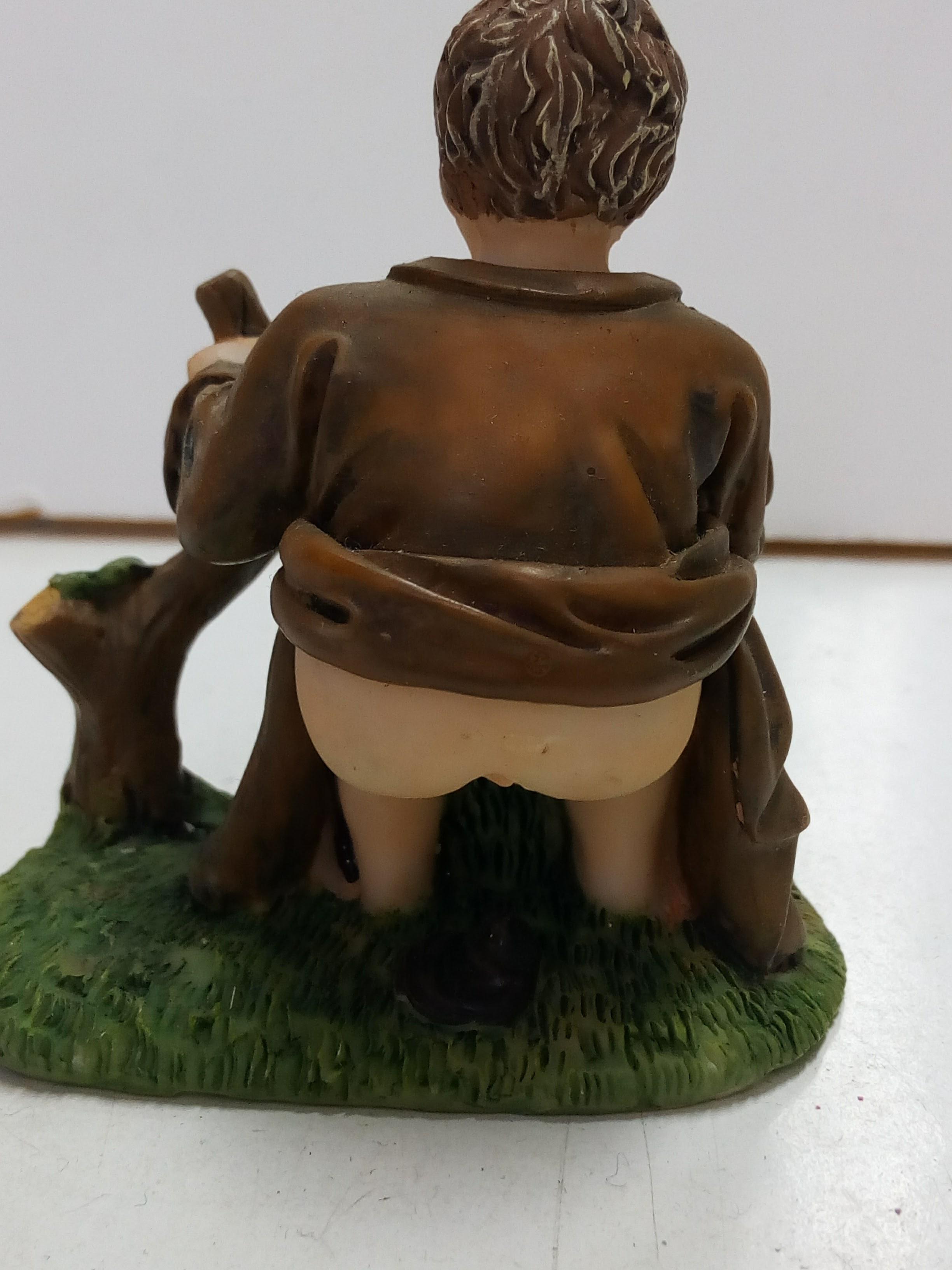 Figura decorativa de niño Caganet