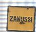 Pin: Zanussi, forma cuadrada, color negro amarillo