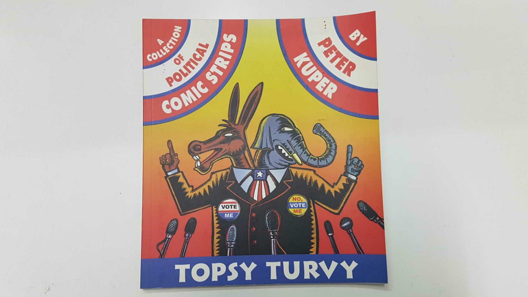 Eye Press: Topsy Turv by Peter Kuper. A collection of political comic strips