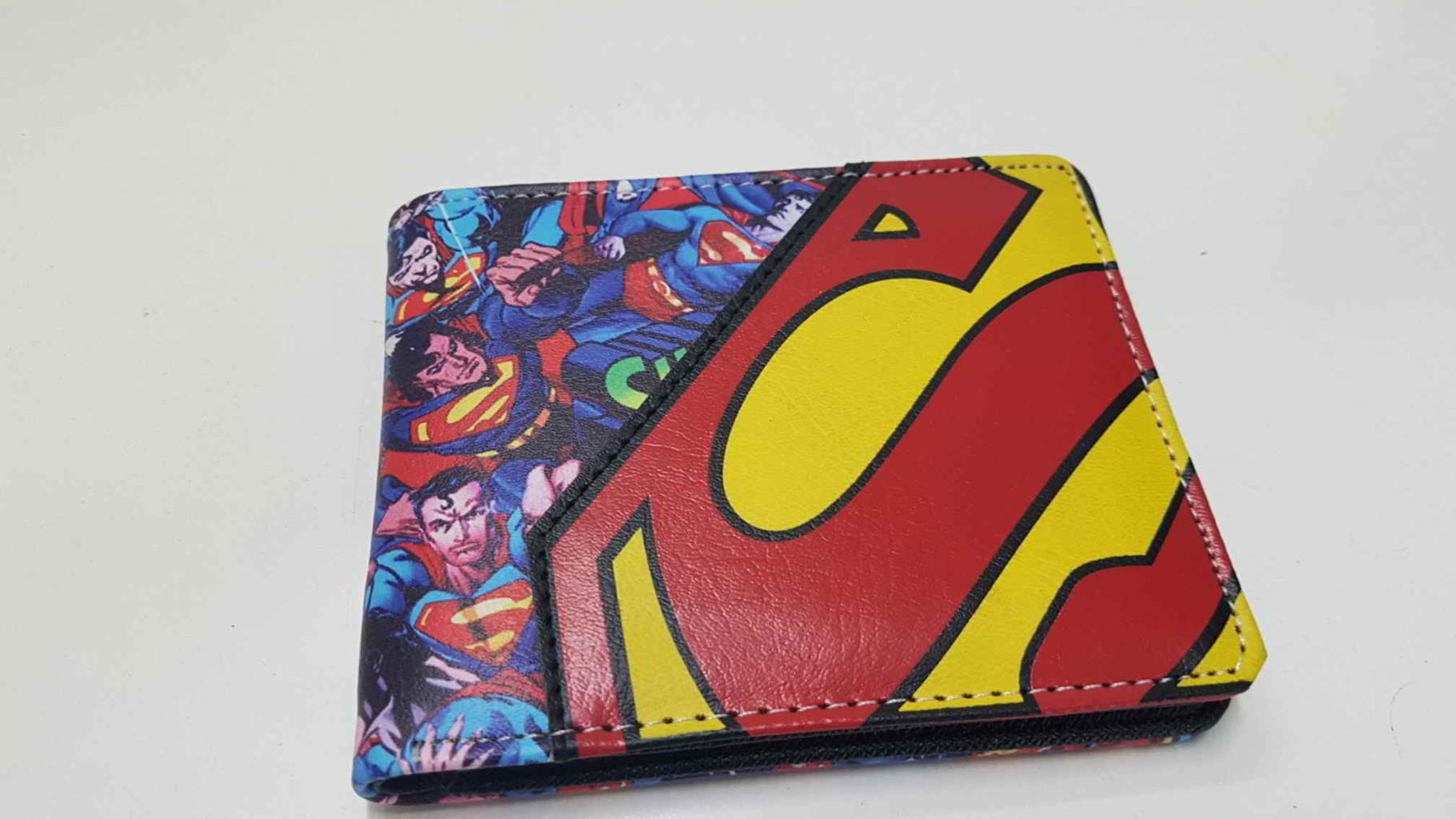 Cartera de bolsillo: Superman en multiples posiciones