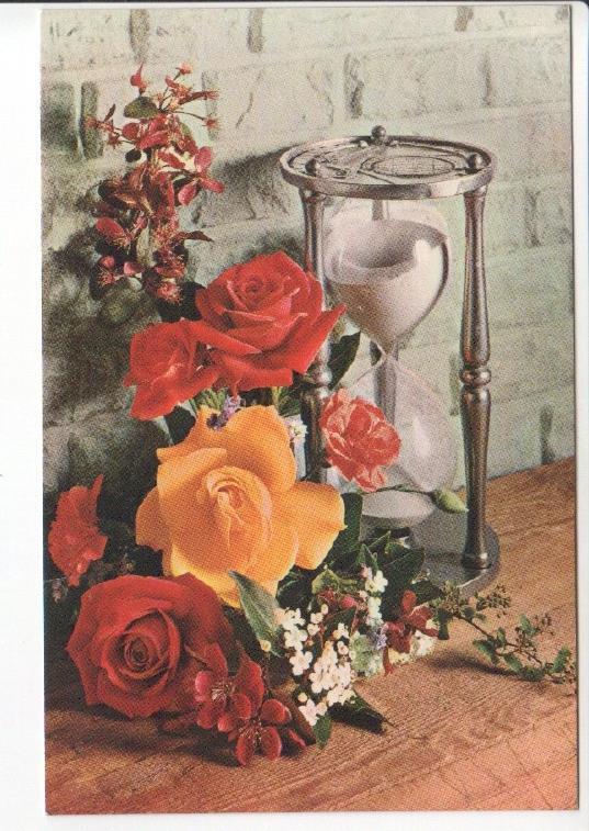 Postal JC0843: Rosas y varias flores mas junto a un relod de arena