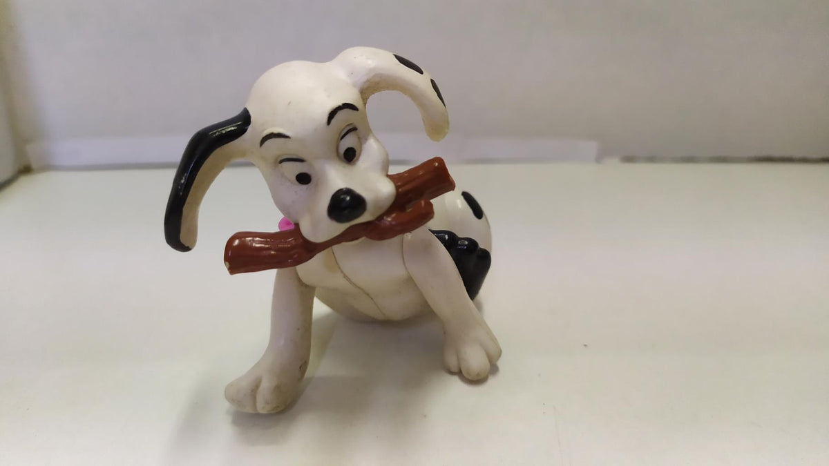 Figura: Perro con palo. 101 Dalmatas