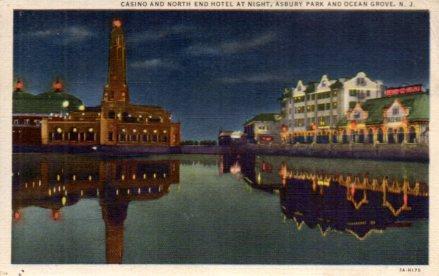 POSTAL PV03868: Casino and North end Hotel at night, Asbury Park and Ocean Grove, N.J.